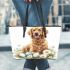 Cute golden retriever with easter eggs and white daisies leather tote bag