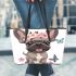 Cute grey french bulldog dog wearing a pink flower leather tote bag