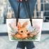 Cute happy baby bunny with big eyes sitting leather tote bag