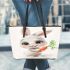 Cute happy white rabbit with big eyes holding one carrot leather tote bag