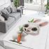 Cute happy white rabbit with big eyes holding one carrot area rugs carpet