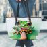 Cute little frog sitting on a pencil leaather tote bag