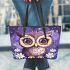 Cute owl cartoon with big eyes and yellow stars on its head leather tote bag