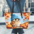 Cute owl in blue hat sitting on the log surrounded leather tote bag