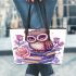 Cute owl sitting on books surrounded by pink roses leather tote bag