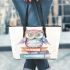 Cute owl sitting on top of books leather tote bag