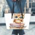 Cute owl sitting on top of books leather tote bag