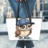 Cute owl wearing a blue cap and shoes leather tote bag