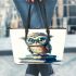 Cute owl wearing blue glasses sitting on books leather tote bag