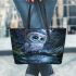 Cute owl with big blue eyes perched leather tote bag