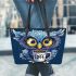 Cute owl with big yellow eyes holding a coffee cup leather tote bag