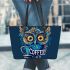 Cute owl with big yellow eyes holding a coffee cup leather tote bag