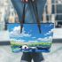 Cute panda lying in the water leather tote bag