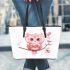 Cute pink owl holding a heart on a branch leather tote bag