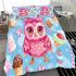 Cute pink owl with a bow on its head surrounded by candy bedding set