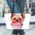 Cute pink yorkshire terrier in a cupcake leather tote bag