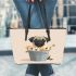 Cute pug dog inside a flower bucket leather tote bag