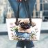 Cute pug puppy sitting in a flower bucket leather tote bag
