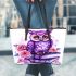 Cute purple owl sitting on top of books surrounded by pink roses leather tote bag