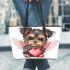 Cute valentine yorkie with angel wings holding a heart leather tote bag