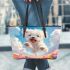 Cute white puppy running in a flower sea leather tote bag