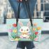 Cute white rabbit sitting on the swing leather tote bag