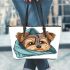 Cute yorkshire terrier dog peeking leather tote bag