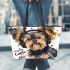 Cute yorkshire terrier dog wearing headphones leather tote bag