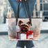 Cute yorkshire terrier inside a large gift box leather tote bag