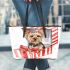 Cute yorkshire terrier inside an open present box leather tote bag