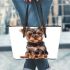 Cute yorkshire terrier puppy in the style of clipart leather tote bag