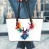 Deer head with colorful watercolor splash behind leather totee bag