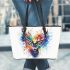 Deer head with colorful watercolor splash behind leather totee bag