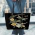 Dragonflies and three flowers on the moon leather tote bag