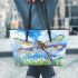 Dragonfly is flying over the grass leather tote bag