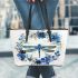 Dragonfly with flowers and leaves leather tote bag