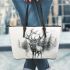 Ethereal deer with large antlers standing in the middle leather totee bag