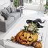 Frog wearing a black witch's hat sitting on top of a halloween pumpkin area rugs carpet