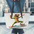 Happy frog wearing sunglasses surfing on a surfboard while holding leaather tote bag