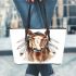 Indian horse with white feathers in its mane leather tote bag