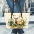 Majestic deer with impressive antlers standing in the forest leather totee bag