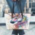Majestic unicorn with vibrant colors leather tote bag