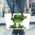 Ominous frog with clover in his hat leaather tote bag