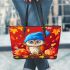 Owl wearing blue hat sitting on wood leather tote bag