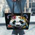 Panda with black and white fur and colorful floral leather tote bag