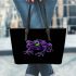 Purple frog with bright green eyes and on a solid leaather tote bag