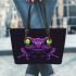 Purple frog with bright green eyes and on a solid leaather tote bag