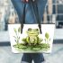 Smiling frog sitting on a pond leaather tote bag