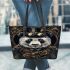 Steampunk panda with top hat and monocle holding golden gears leather tote bag