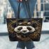 Steampunk panda with top hat and monocle holding golden gears leather tote bag